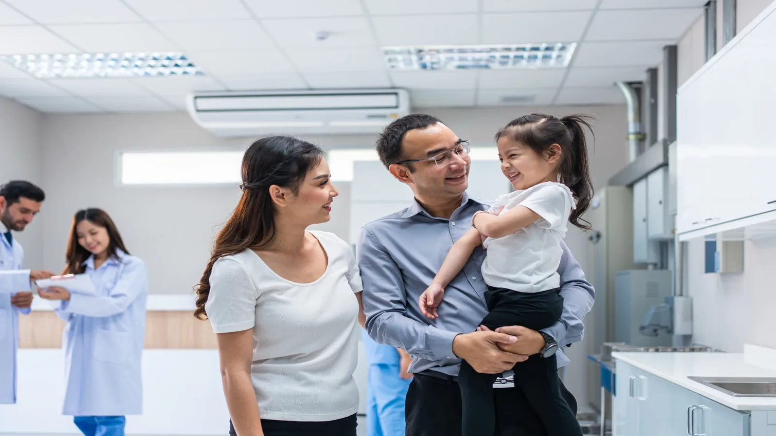 Hispanic patient consulting with a bilingual healthcare provider in a US clinic