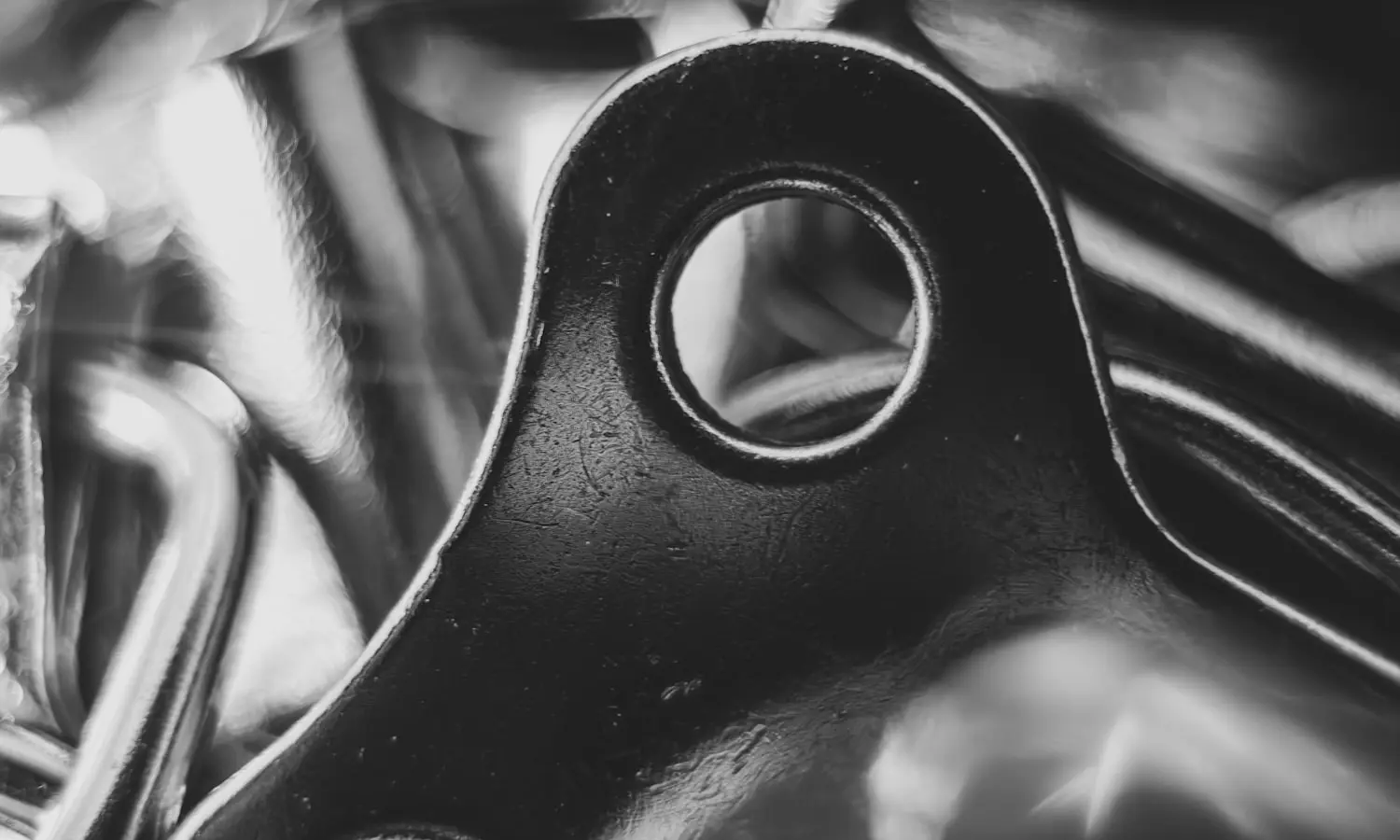 A stamped metal part, the kind quoted forty times a month in Detroit