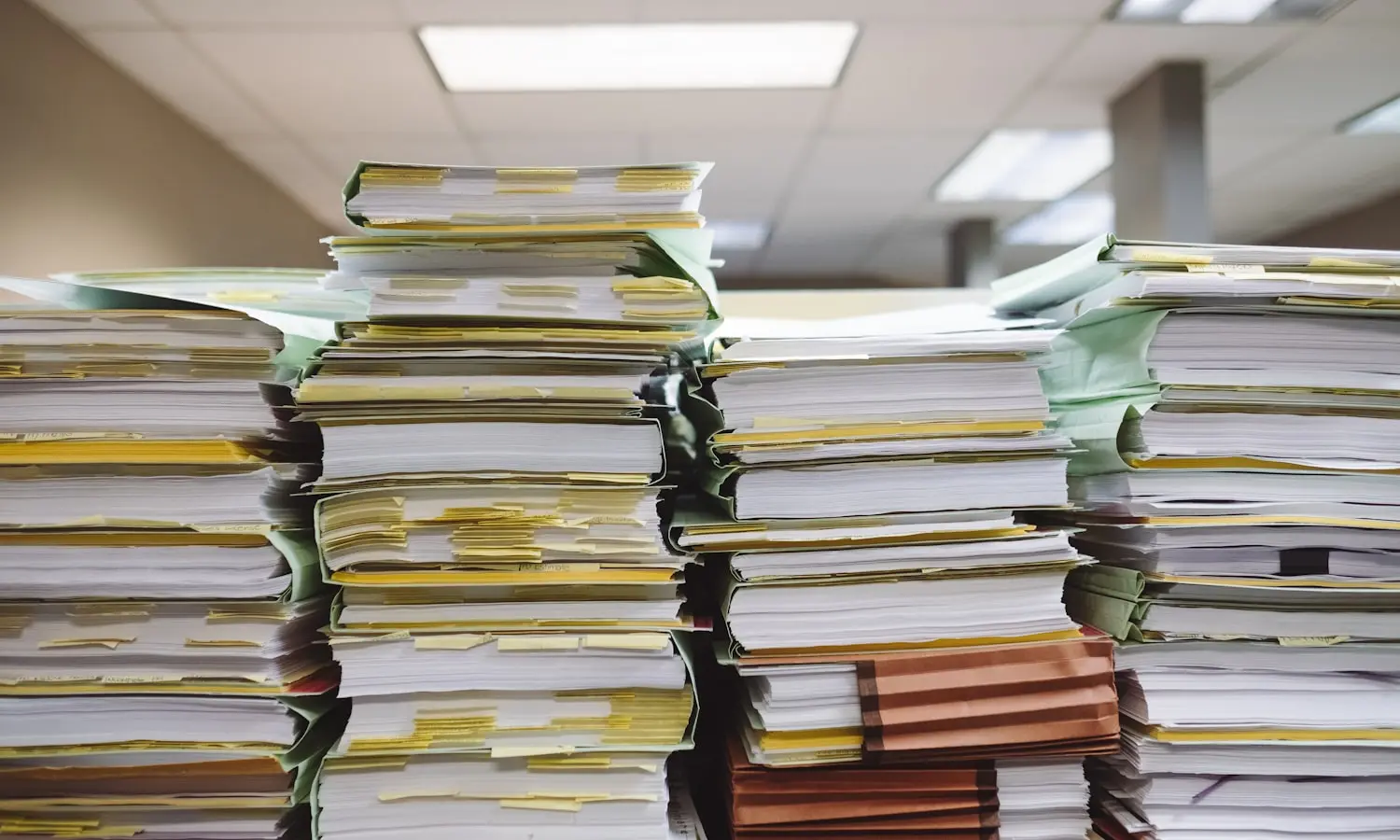 The stack of statements somebody reconciles by hand every month