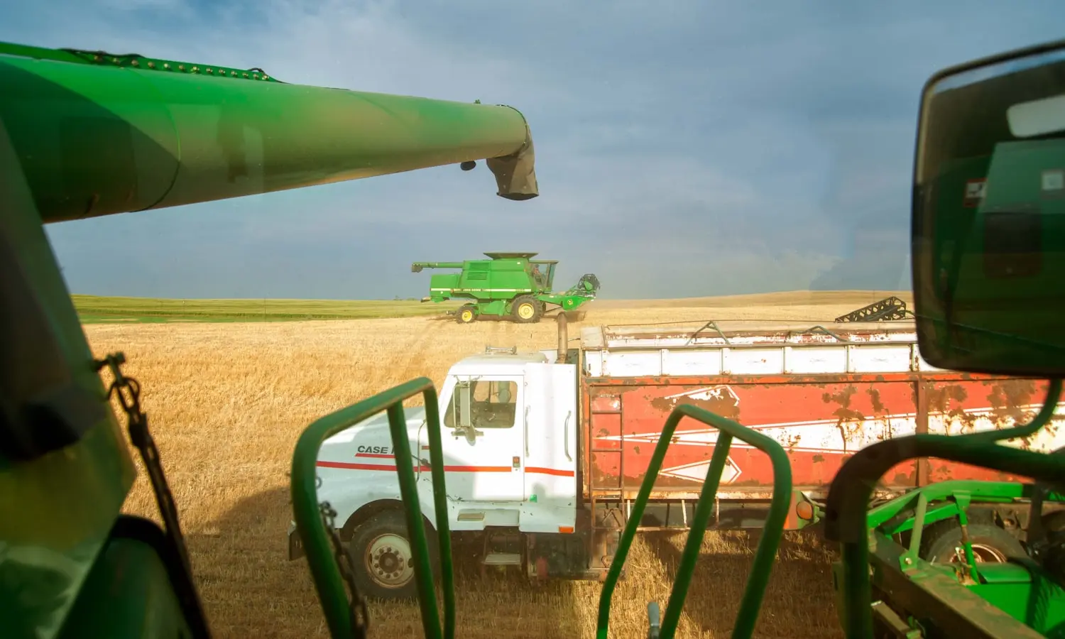 Harvest equipment working a field, one of the three modes freight moves in here
